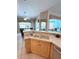 Kitchen with double sink and view of pool at 2454 Sonoma W Dr, Nokomis, FL 34275