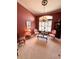 Home office featuring built-in bookshelves and a large desk at 2454 Sonoma W Dr, Nokomis, FL 34275