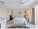 Cozy bedroom with a queen-size bed and white dresser at 1708 Lakeside Dr # 1710-B, Venice, FL 34293
