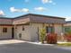 Single story condo with brown roof and landscaped yard at 1708 Lakeside Dr # 1710-B, Venice, FL 34293