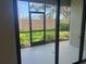 View of a screened patio with access to a grassy backyard at 1498 Maseno Dr, Venice, FL 34292