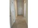 Clean and bright hallway with tile flooring at 1498 Maseno Dr, Venice, FL 34292