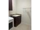 Laundry room with sink and storage at 1498 Maseno Dr, Venice, FL 34292