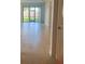 Bright living room with tile floor and sliding doors to backyard at 1498 Maseno Dr, Venice, FL 34292