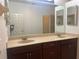 Double vanity bathroom with large mirror and separate shower at 1498 Maseno Dr, Venice, FL 34292