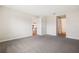 Large bedroom with plush gray carpeting and access to the bathroom at 16090 Highgate St, Port Charlotte, FL 33953