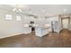 Modern kitchen with white cabinets, granite countertops, and stainless steel appliances at 16090 Highgate St, Port Charlotte, FL 33953