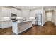 Modern kitchen with white cabinets, granite countertops, and stainless steel appliances at 16090 Highgate St, Port Charlotte, FL 33953