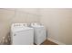 Laundry room with Whirlpool washer and dryer at 16090 Highgate St, Port Charlotte, FL 33953