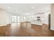 Open living room with kitchen and screened patio access at 16090 Highgate St, Port Charlotte, FL 33953