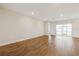 Bright living room with tile floors and sliding glass doors leading to a patio at 16090 Highgate St, Port Charlotte, FL 33953