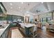 Open-concept kitchen featuring a large island, pendant lighting, and high-end appliances at 284 Bocelli Dr., Nokomis, FL 34275