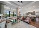 Bright living room with a large glass windows, hardwood floors, and an open floor plan at 284 Bocelli Dr., Nokomis, FL 34275