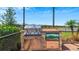 Outdoor kitchen with stainless steel grill and refrigerator at 15177 Spanish Point Dr, Port Charlotte, FL 33981