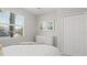 Bedroom with dresser, closet, and a large window at 15177 Spanish Point Dr, Port Charlotte, FL 33981