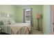 Bright bedroom with striped bedding and built-in closet at 15177 Spanish Point Dr, Port Charlotte, FL 33981