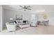 Open living room with comfy seating, coffee table, and dining area view at 15177 Spanish Point Dr, Port Charlotte, FL 33981