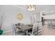 Open dining room with table, chairs, and kitchen view at 15177 Spanish Point Dr, Port Charlotte, FL 33981