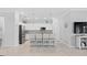 Bright kitchen features white cabinets, granite counters, and stainless steel appliances at 15177 Spanish Point Dr, Port Charlotte, FL 33981