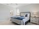 Bright bedroom with a queen-size bed and ensuite bathroom at 15177 Spanish Point Dr, Port Charlotte, FL 33981