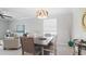 Dining area with table, chairs, and adjacent living room at 15177 Spanish Point Dr, Port Charlotte, FL 33981