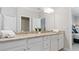 Bathroom with granite countertop and white cabinets at 15177 Spanish Point Dr, Port Charlotte, FL 33981