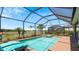 Private screened pool with spa and tranquil water views at 15177 Spanish Point Dr, Port Charlotte, FL 33981