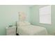 Light bedroom with a bed and window with blinds at 15177 Spanish Point Dr, Port Charlotte, FL 33981