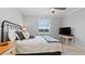 Bright bedroom with a comfortable bed, large window, and TV at 15177 Spanish Point Dr, Port Charlotte, FL 33981
