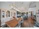 Elegant dining room with wooden table and chairs, adjacent to the kitchen at 284 Bocelli Dr., Nokomis, FL 34275
