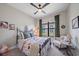 Bedroom with floral bedding, an ornate bed frame, and a seating area at 284 Bocelli Dr., Nokomis, FL 34275