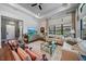 Spacious living room with large windows, comfortable seating, and hardwood floors at 284 Bocelli Dr., Nokomis, FL 34275