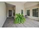 Inviting front entry with paver stones and a potted plant at 284 Bocelli Dr., Nokomis, FL 34275