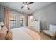 Bedroom with blush-toned bedding and a white dresser at 284 Bocelli Dr., Nokomis, FL 34275