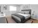 Bright bedroom with decorative pillows and lots of natural light at 472 Circlewood Dr # L9, Venice, FL 34293