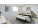 Cozy bedroom with white linens and a decorative bench at 472 Circlewood Dr # L9, Venice, FL 34293