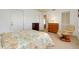 Guest bedroom with a double bed and recliner chair at 472 Circlewood Dr # L9, Venice, FL 34293