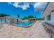Community pool with lounge chairs and a pergola at 472 Circlewood Dr # L9, Venice, FL 34293