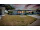 Single-story home with a carport and well-maintained lawn at 472 Circlewood Dr # L9, Venice, FL 34293