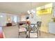 Open concept dining area adjacent to living room at 472 Circlewood Dr # L9, Venice, FL 34293
