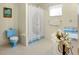 Clean bathroom with a shower/tub combo and blue vanity at 472 Circlewood Dr # L9, Venice, FL 34293