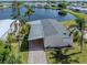 High-angle view of a mobile home with carport and waterfront view at 109 Lakeview Dr, North Port, FL 34287