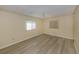 Empty bedroom with neutral walls, wood-look flooring, and a ceiling fan at 109 Lakeview Dr, North Port, FL 34287