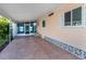Covered carport with screened entryway and decorative concrete at 109 Lakeview Dr, North Port, FL 34287