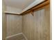 Empty closet with built-in shelving and wood-look flooring at 109 Lakeview Dr, North Port, FL 34287