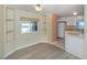 Dining area with built-in corner shelves adjacent to the kitchen at 109 Lakeview Dr, North Port, FL 34287