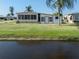 View of a canal or lake in front of a mobile home at 109 Lakeview Dr, North Port, FL 34287