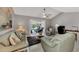 Bright and airy Gathering room features comfortable seating and access to the pool at 1567 Waterford Dr, Venice, FL 34292