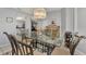 Casual dining area with glass table and view to the kitchen and living room at 1567 Waterford Dr, Venice, FL 34292