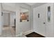Entryway with tiled floors, neutral walls and a view into another room at 1567 Waterford Dr, Venice, FL 34292